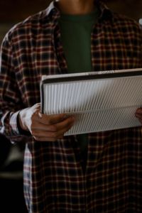 a person holding a new cabin filter
